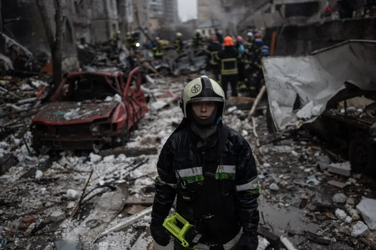 Ukrainian emergency workers respond after Russian missile attack on January 2, 2024